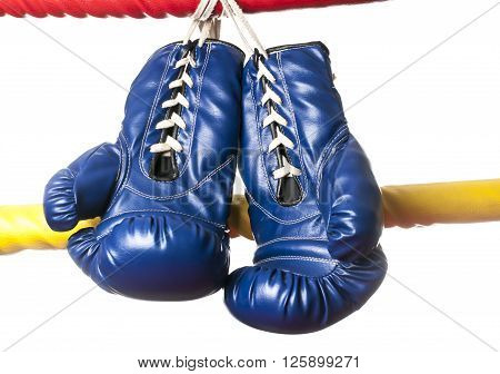 Boxing series : Blue boxing glove hanging on rope