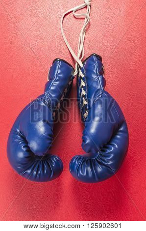 Boxing series : Blue boxing gloves on leather background