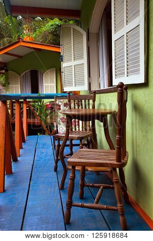 Brazil traditional house. table and chairs on the terrac. Brasil