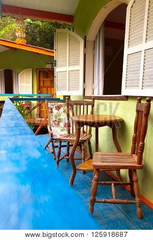 Brazil traditional house. table and chairs on the terrac. Brasil