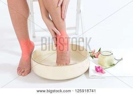 relaxation with a foot bath for woman fo woman' legs ankle pain
