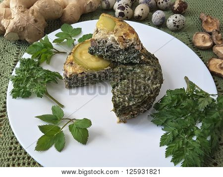Goutweed squash with mushrooms omelet on plate, Cooking with ginger, wild plants and quail eggs