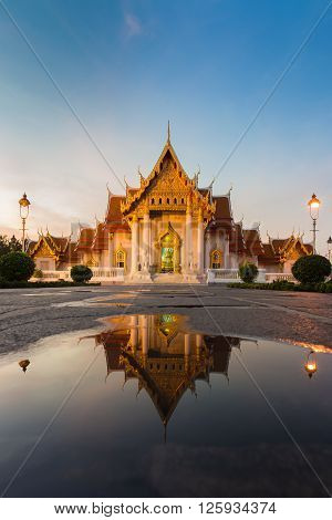 The Marble temple named Wat Benchamabopit Dusitvanaram, Thailand landmark at twilight, with water reflection