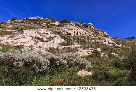 View of the Necropolis of Realmese. Necropoli Pantalicana is an achaeological park in Calascibetta Sicily