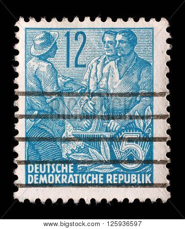 GDR - CIRCA 1955: A stamp printed in GDR, shows Farmer, worker, intellectuals, series Five-year plan, circa 1955
