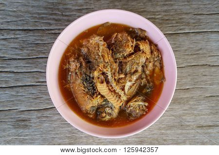 fish boiled with salt on wood table thaifood