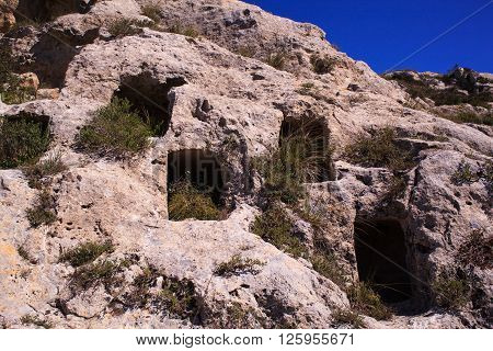 View of the Necropolis of Realmese. Necropoli Pantalicana is an achaeological park in Calascibetta Sicily