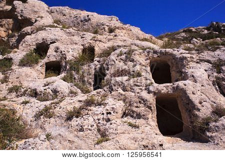 View of the Necropolis of Realmese. Necropoli Pantalicana is an achaeological park in Calascibetta Sicily