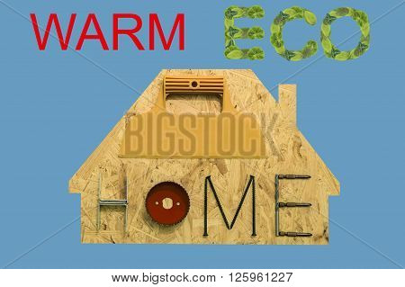 Silhouette of a suburbian house with mounting materials at OSB sheet. Objects on blue background.