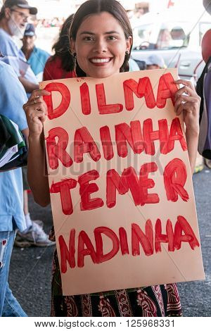 Brasilia, Brazil April 16th 2016 A young woman shows her support at a rally for President Dilma Rousseff