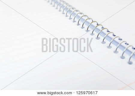 notebook with a metal spring and blank pages