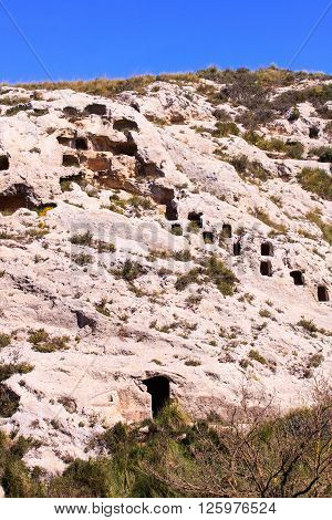 View of the Necropolis of Realmese. Necropoli Pantalicana is an achaeological park in Calascibetta Sicily