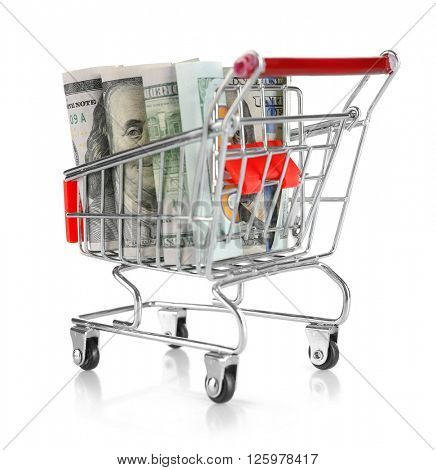 Shopping cart with dollars inside isolated on white