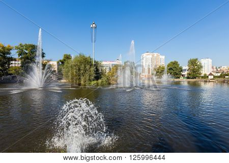 Lipetsk, Russia - September 18, 2014: Komsomolskiy pond with Fountains in sunny day, Lipetsk, Russia