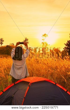 outdoors camping grass highlands mountain in the Sunset.