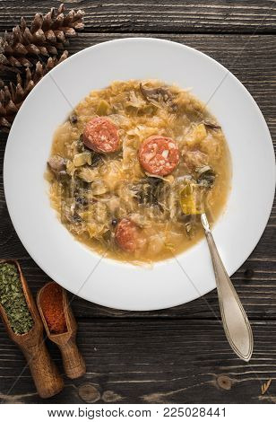 Slovak christmas cabbage soup with mushrooms on natural background.