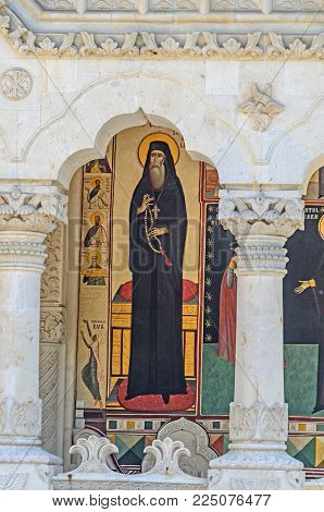 VALEA JIULUI, ROMANIA - AUGUST 1, 2017: The old Lainici Monastery on a summer's day, detail of the exterior painted wall.