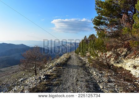 Hiking Trail High in the Rocky Mountain/Rocky valley with a wild path/ beautiful mountain landscape scenery