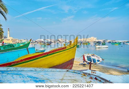 The View On Eastern Harbor And Qaitbay Citadel, Through The Bows Of Old Wooden Boats, Alexandria, Eg