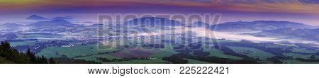 Morning panoramic view of the landscape with fog with meadows and forests