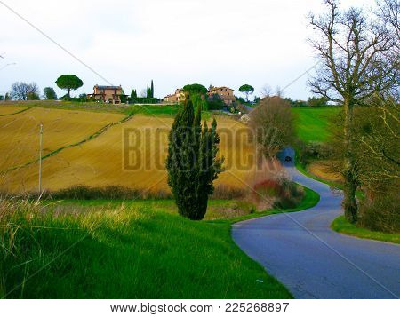 COUNTRYSIDE NEAR SIENA OF ITALY WITH BEAUTIFUL HILLS