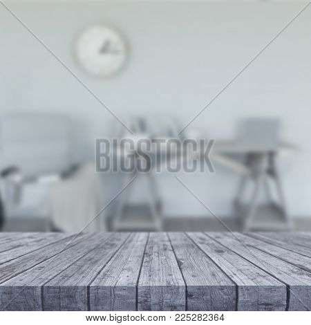 3D render of a white wooden table looking out to a defocussed room interior