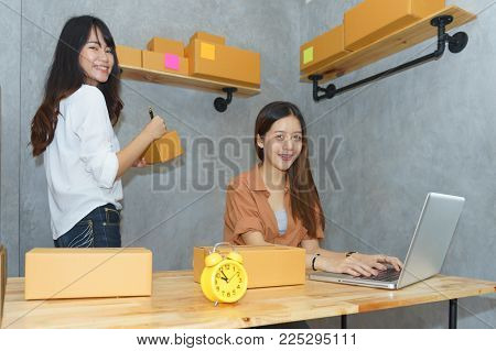 Asian young woman business work at home for online shopping and sale.small and medium enterprise business
