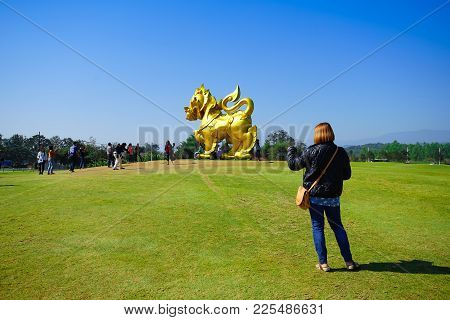 Chiang Rai, Thailand - December 23, 2017: Woman Preparing To Take A Photo Singha Figure In Singha Pa
