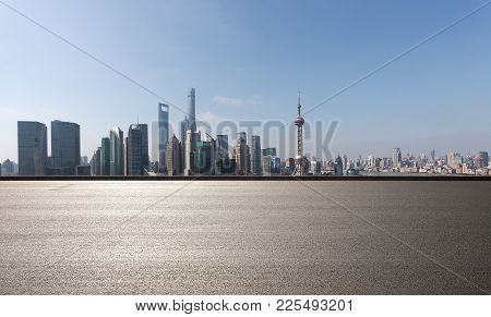 Empty Road Floor Surface With Modern City Landmark Buildings In Shanghai Skyline