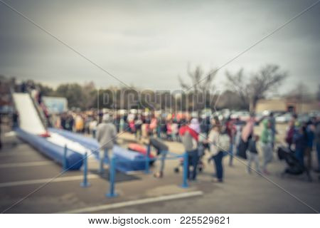 Blurred Giant Snow Tube Inflatable Slide At Community Event In Usa
