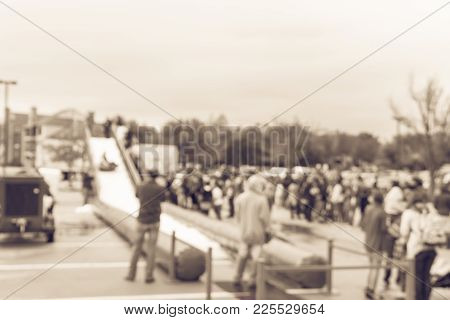 Blurred Giant Snow Tube Inflatable Slide At Community Event In Usa