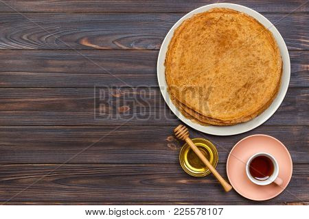 Hot Pancakes With Honey On A Plate, Breakfast Tea With Crepes.