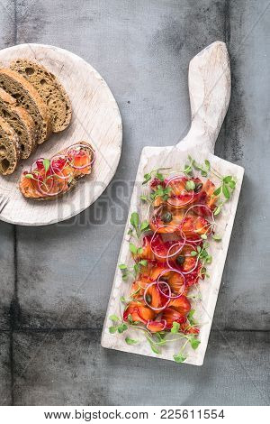 Cured Salmon With Onion, Greens And Bread, Scandinavian Dish.