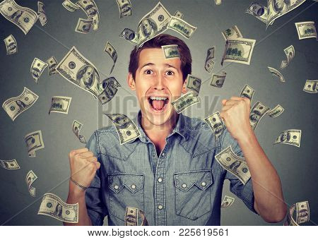 Happy Young Man Screaming Super Excited. Portrait Ecstatic Guy Celebrates Success Under Money Rain F