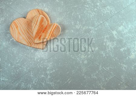 Couple Of Wooden Hearts On An Abstract Background. Valentine's Day Background.