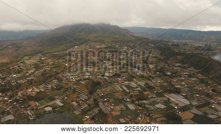 Lake Batur In The Crater Of A Volcano. Aerial View Of Volcano Mount And Lake Batur Located In Kintam