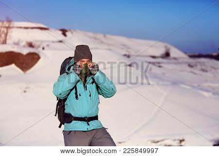 Man, Covering His Face With A Scarf, Wearing Grey Hat And Blue Anorak, Doing Outdoor Activity In Win
