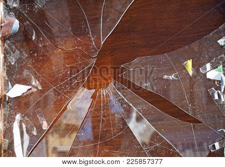 Broken Shopwindow Closeup In Summer Time In The City