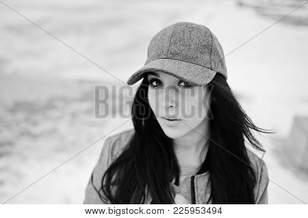 Stylish Brunette Girl In Gray Cap, Casual Street Style On Winter Day.
