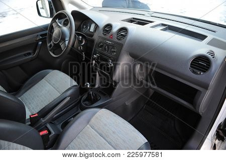 Interior Of A Modern Car With Six Gear Lever And Steering Wheel. Prestigious Salon Of The Minivan