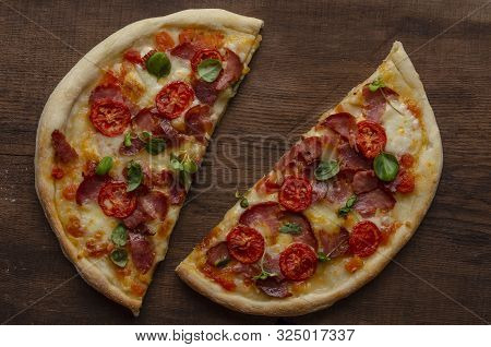 Slice Of Pizza With Meat And Bazil Sprout. Italian Food