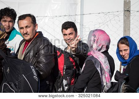 Gevgelija, Macedonia - December 13, 2015  Refugees Smiling Waiting To Enter Macedonia From The City 