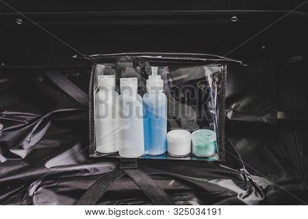 Packing For A Flight, Transparent Bag With Small Lotions For Liquids And Gel For Security Check Comp
