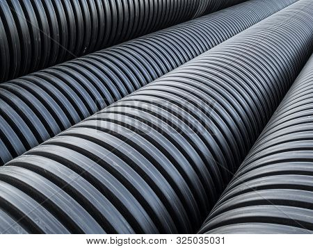 Corrugated Double-walled Pipes. Pipes For Use In Outdoor Sewerage Systems. Big Black Pipes