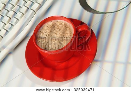 Cup Of Coffee, Dcs And Keyboard On A Studio Background