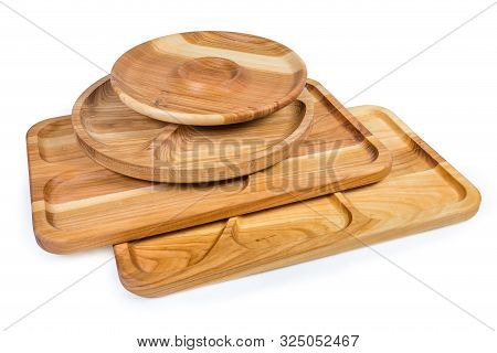 Different Empty Compartmental Dishes And Serving Boards Various Shapes Made With Hardwood On A White