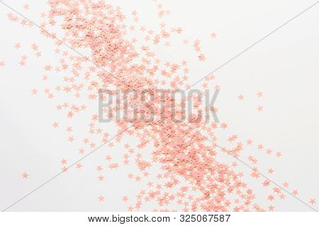 Pastel Pink Confetti Stars On A White Background. Holiday Party Concept