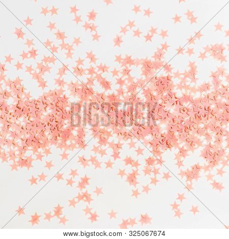 Pastel Pink Confetti Stars On A White Background. Holiday Party Concept