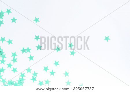 Pastel Mint Confetti Stars On A White Background. Holiday Party Concept