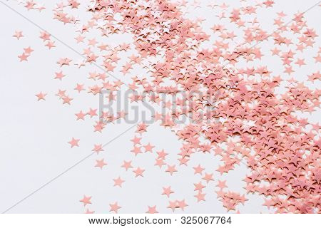 Pastel Pink Confetti Stars On A White Background. Holiday Party Concept
